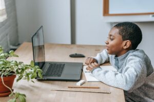 black boy watching video on laptop